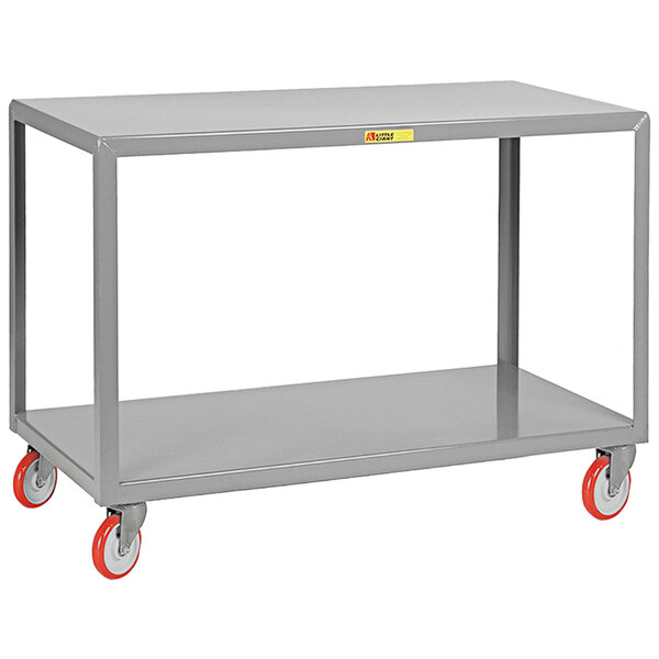 A grey steel Little Giant table cart with red wheels.