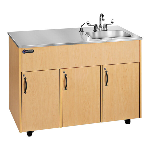 An Ozark River Manufacturing stainless steel portable hand sink with a deep basin and maple counter top on wheels.
