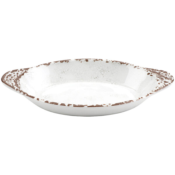 A white oval melamine dish with a brown speckled rim.