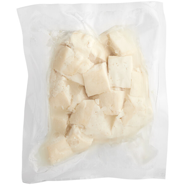 A plastic bag of cubed white firm tofu.