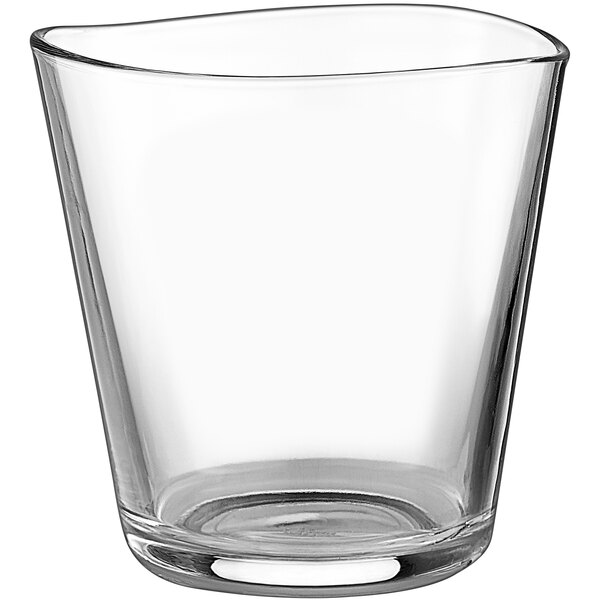 A clear Centique Rocks glass with a curved edge.