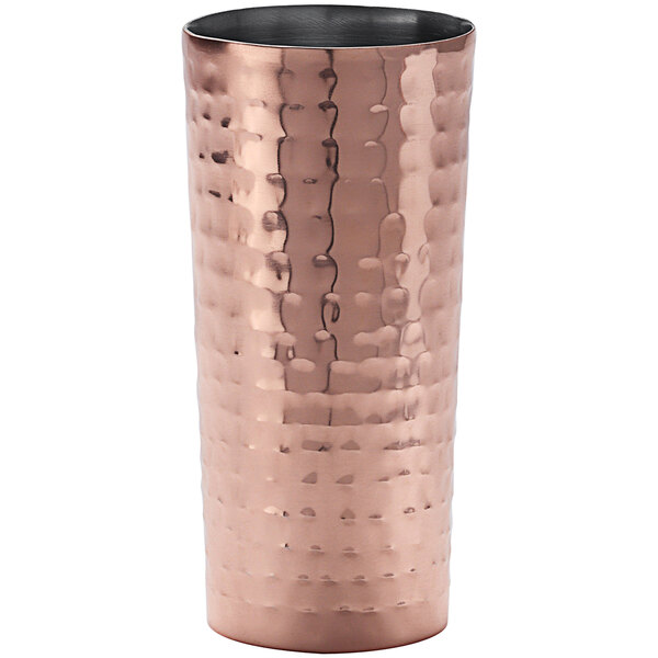 An American Metalcraft hammered copper Collins glass with a textured surface.