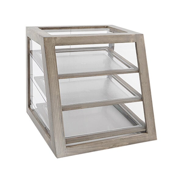 A wooden display case with glass shelves on a table.