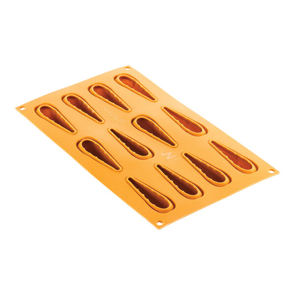 A white silicone baking mold with 12 carrot-shaped cavities.