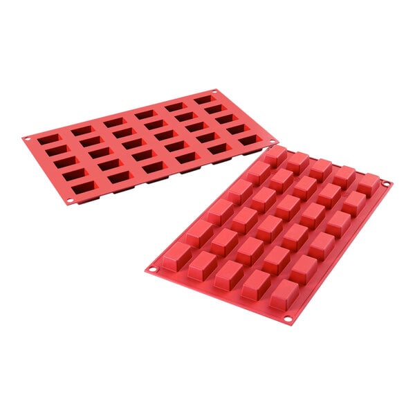 A red rectangular Silikomart silicone baking mold with 30 rectangular cavities.