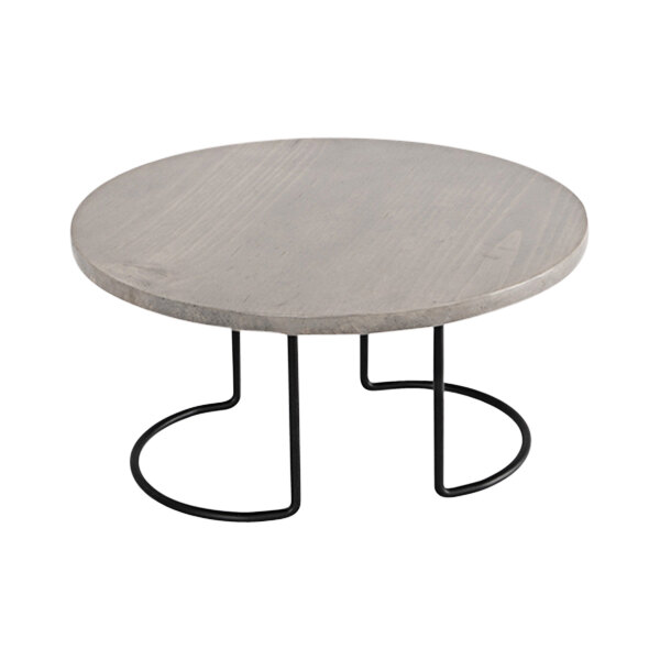 A Cal-Mil round grey and black pine display riser on a round table with metal legs.