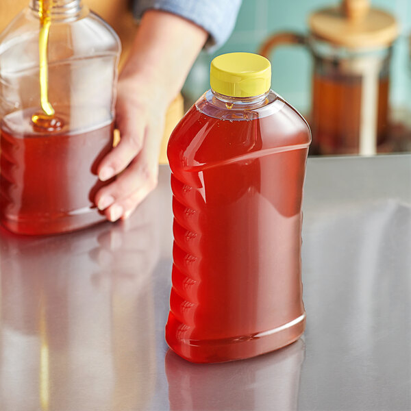 27 oz. (40 oz. Honey Weight) Ribbed Hourglass PET Honey Bottle with
