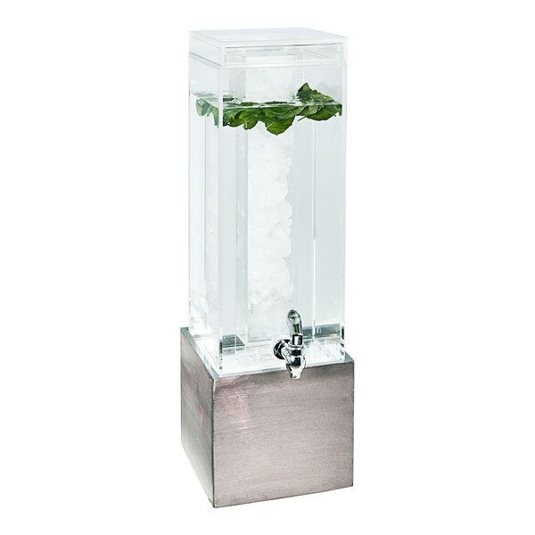 A Cal-Mil gray square plastic beverage dispenser with a plant in it.