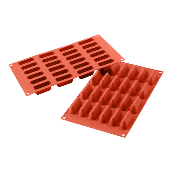 A close-up of a red Silikomart silicone baking mold with 24 rectangular cavities.