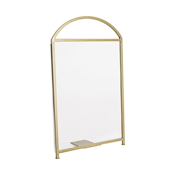A white board with a gold frame with Cal-Mil Heritage gold arched frame displayette.