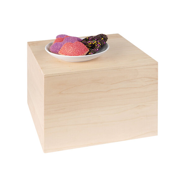A plate of doughnuts on a Cal-Mil maple wood display cube.