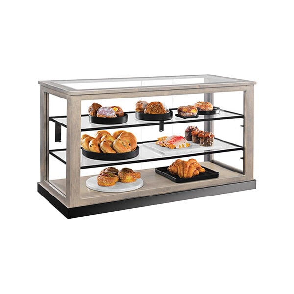A Cal-Mil bakery display case with various pastries and breads.
