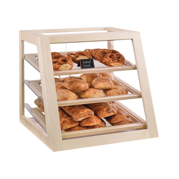 A Cal-Mil maple wood self-serve display case with bread and pretzels.