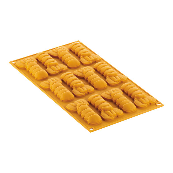 A yellow silicone Scampo mold with 12 lobster tail shapes.