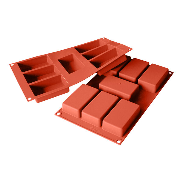A close-up of a Silikomart red rectangle silicone baking mold with 7 rectangular cavities.