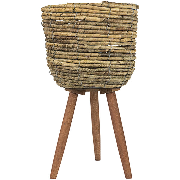 A wooden tripod basket stand holding a small wicker basket.
