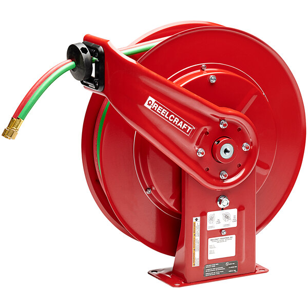 A red Reelcraft hose reel with a green hose.