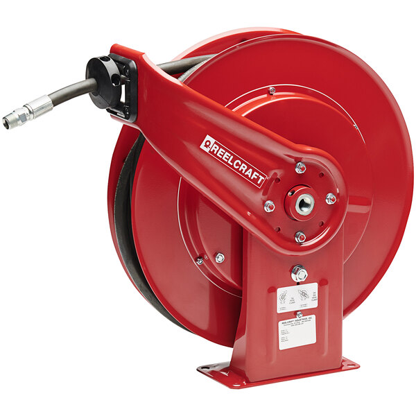A red Reelcraft hose reel with a hose inside.