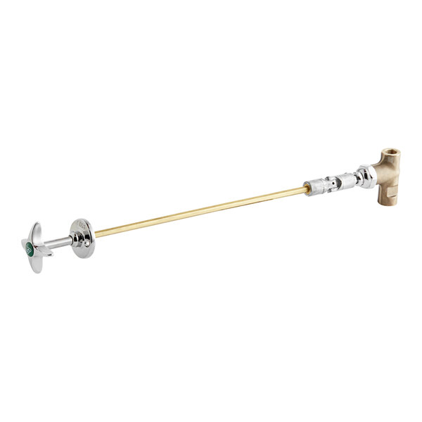 A T&S brass and gold plated remote control straight valve with a green handle.