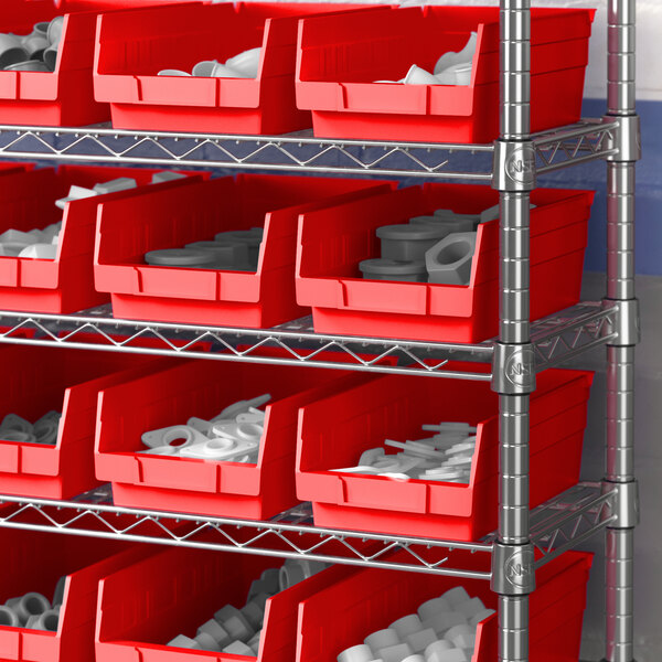 A red shelf bin with white objects inside.