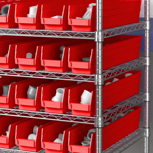 A metal shelving unit with red Regency shelf bins.