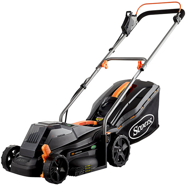 A black and orange Scotts cordless push lawn mower with wheels.