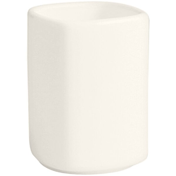 An ivory porcelain toothpick holder with a lid.