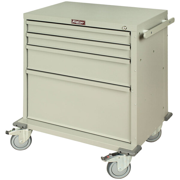 A grey Harloff medical cart with four drawers and key lock on wheels.