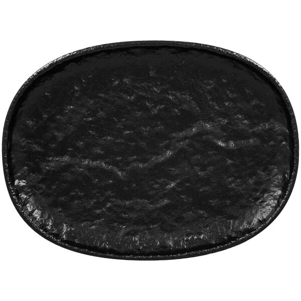 A black oval porcelain platter with a white background.