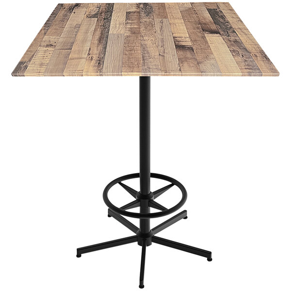 A Holland Bar Stool rustic wood square bar height table with a foot rest base.