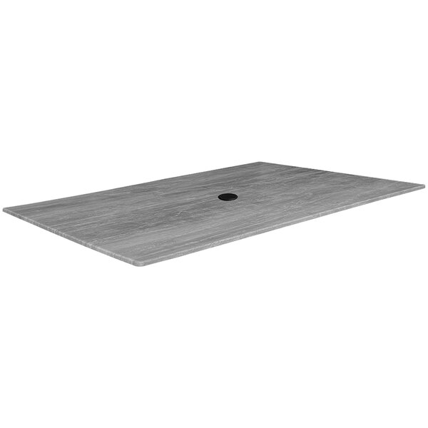 A grey rectangular table top with a hole in the center.