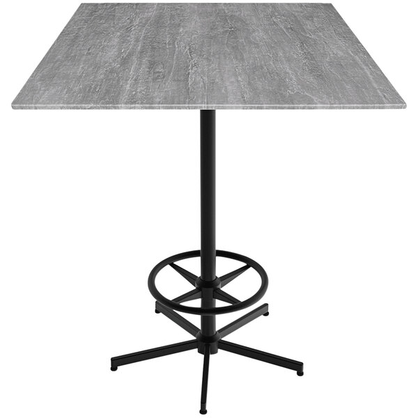 A Holland Bar Stool EuroSlim square table with a grey surface and metal base.