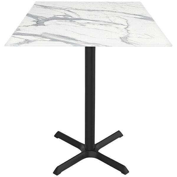A Holland Bar Stool EuroSlim white marble bar height table with a black base.