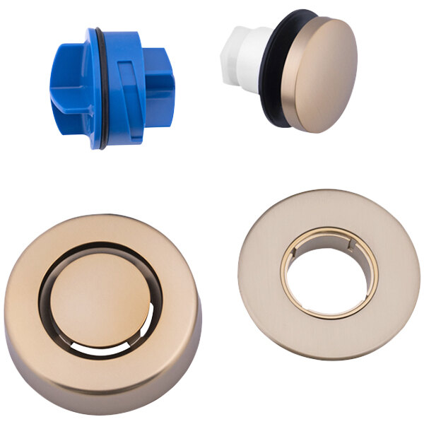 A Dearborn Dblue K97CB trim kit with brass and blue plastic circular objects and a Champagne Bronze plug.
