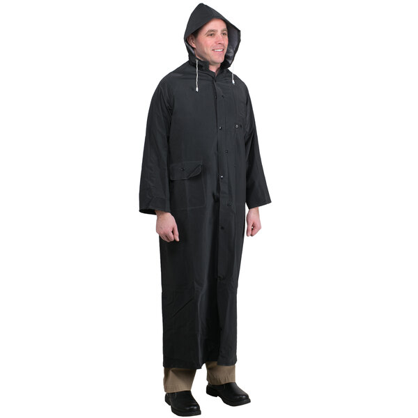 A man wearing a long black Cordova rain coat.