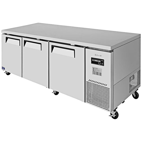 A white rectangular Turbo Air undercounter refrigerator with three drawers.