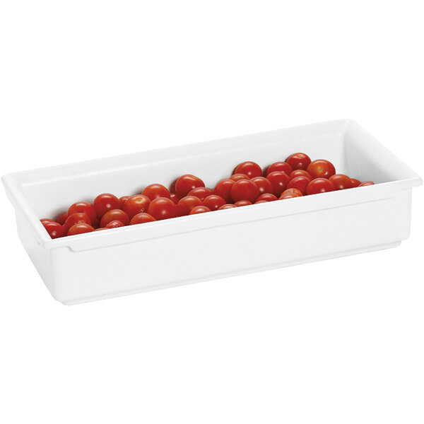 A GET white aluminum food pan with cherry tomatoes inside.