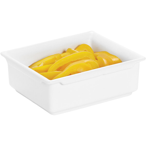 A white GET Bugambilia 1/6 size food pan with yellow bell peppers inside.