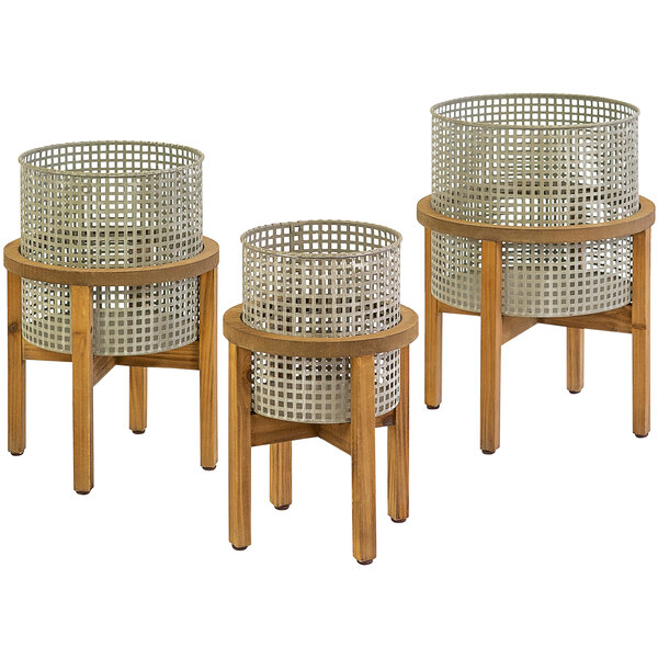 Three woven metal baskets with wooden stands on a white background.