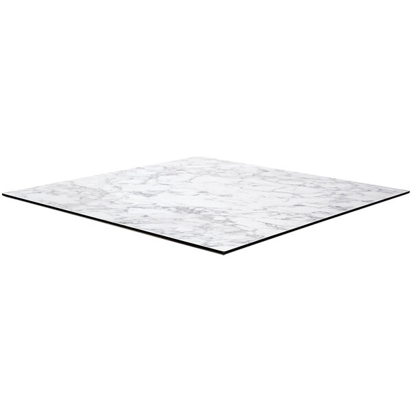 A white marble square table top with black edges.