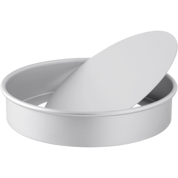 A round white metal LloydPans cheesecake pan with a removable bottom.