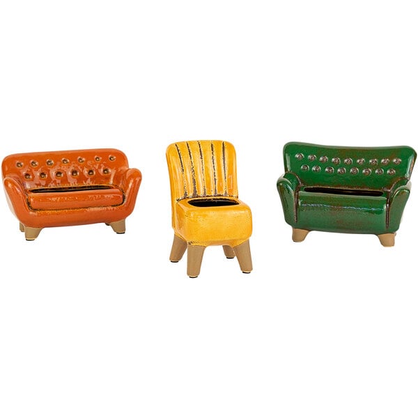 A group of colorful ceramic chairs and a sofa with brown legs.