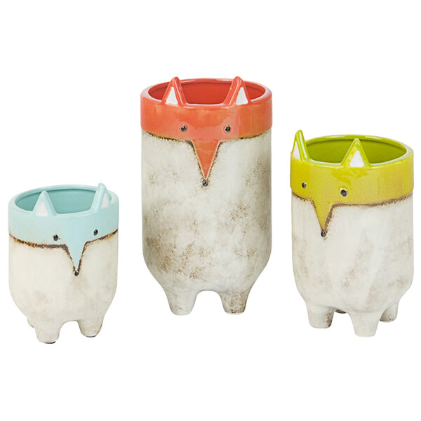 Three ceramic pots with foxes on them.