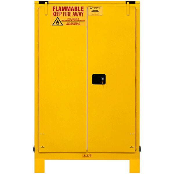 A yellow Durham Mfg safety cabinet with self-close doors and a lock.