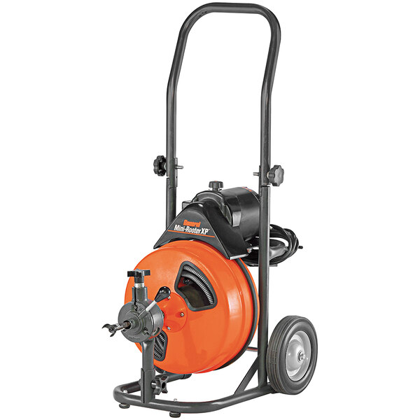 A close-up of a black and orange General Pipe Cleaners Mini-Rooter XP drain cleaning machine.