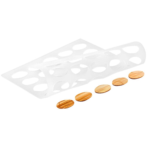 A white plastic container with oval brown silicone baking molds and a few round brown objects.