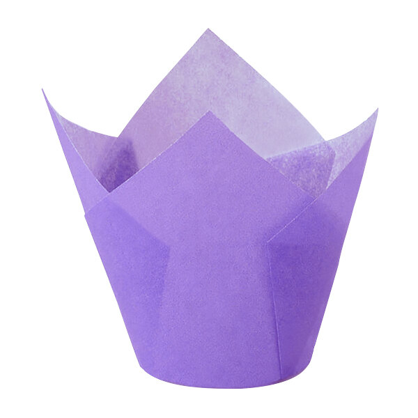 A purple paper Novacart tulip baking cup with a flower design.