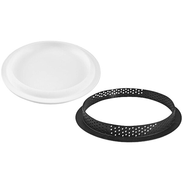 A white plate with a black circular silicone tart ring inside.
