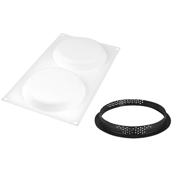 A white circular silicone baking mold with two black circular rings.