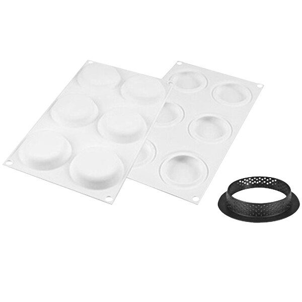 A white silicone mold with 6 round tart rings.